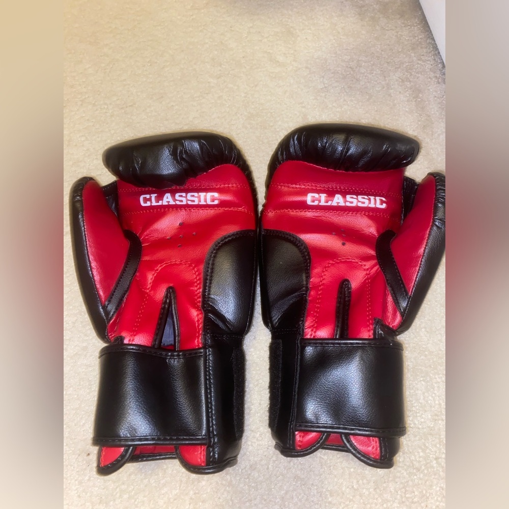 Black and Red Boxing Gloves with athletic wrap